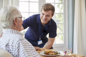 Male Assistant With Senior Patient