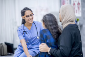 Medical assistant talking with patients 