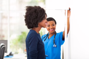Nurse Measuring Patient’s Height