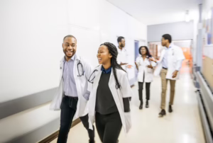 Doctors And Medical Assistants Talk At Work