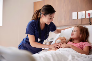 Medical assistant caring for child patient