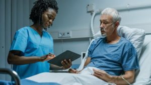 Medical Assistant Takes Patient History In Hospital