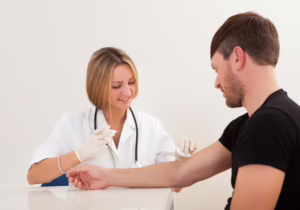 Woman Drawing Blood From Man