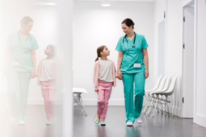 LPN walking with young girl