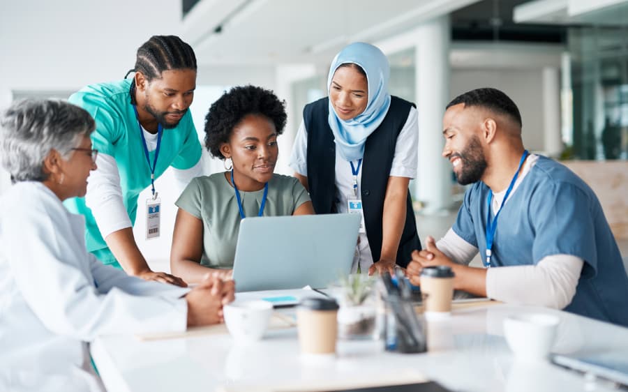 Teamwork, planning, and meeting with doctors and laptop for medical, review, and healthcare