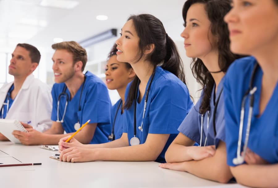 Medical students listening to lecture