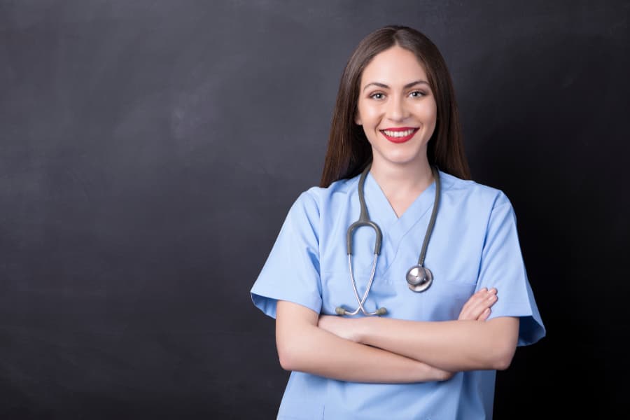 Portrait of nurse smiling with stethoscope and in scrubs 